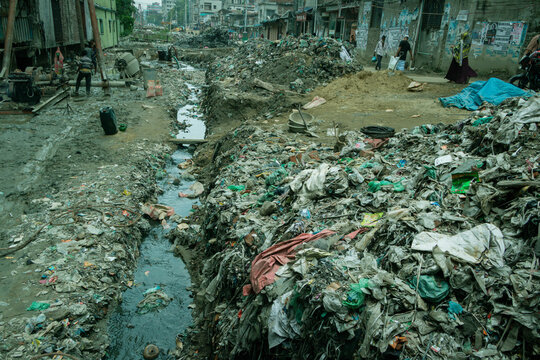 Dhaka, Bangladesh - 15 June 2026: View of a heavily polluted canal filled with plastic waste and debris near the Buriganga River in an urban area.