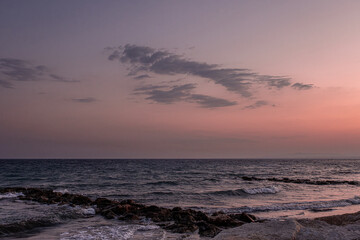 Obraz premium View of Pervolia village sea coast, beach and sea, after sunset, Larnaca district, Cyprus