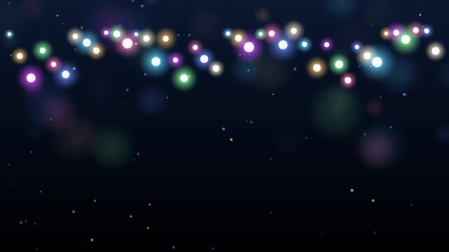 Colorful party string lights hanging against dark background with gentle swinging motion and soft bokeh sparkles creating festive celebratory digital footage.