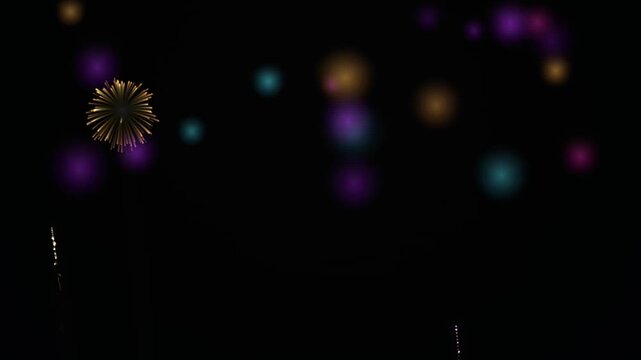 Festive firework display exploding in night sky with colorful bokeh lights for celebrations and New Year's Eve parties.