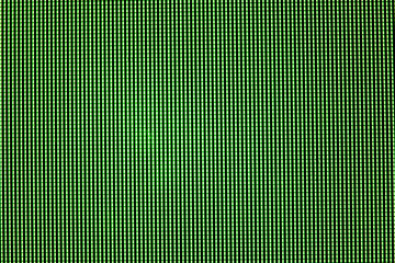 Green LED screen overlay, pixel matrix structure macro view on computer monitor display showing © valiantsin