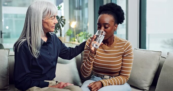 Sad, woman and water with therapist for counseling, emotional support and empathy. Grief, psychologist and patient with depression for hydration, trauma recovery and coping assistance with drink