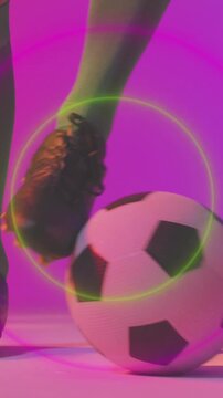 Animation of confetti falling over caucasian footballer with football