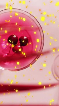Animation of confetti falling and cocktail on pink background