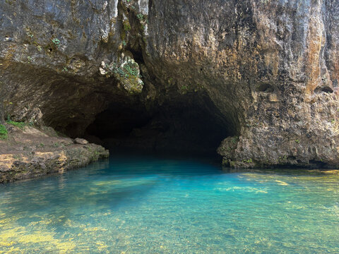 blue cave off the current river on a warm summer day