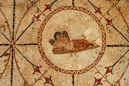 Risan, Montenegro - 05 July 2005: View of the Roman mosaic depicting Hypnos with intricate geometric patterns and floral motifs on the floor.