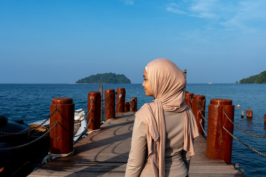 Side view of a beautiful young woman at Manukan island Tunku Abdul Rahman Marine Park Sabah Borneo Malaysia