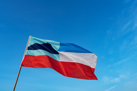 Sabah state flag against blue sky with copy space