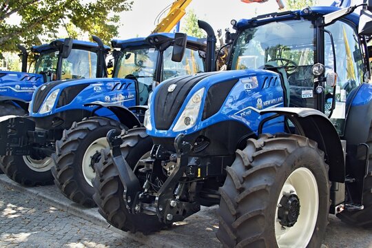 New Holland tractors lining up at agricultural exhibition