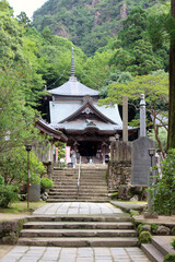 Fototapeta premium Main Hall Hondo and Pilgrim at Okuboji Temple on Shikoku Henro Pilgrimage, Kagawa, Japan 2026