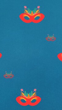 Animation of carnival mask repeated on blue backgroud