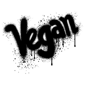 Graffiti vegan text sprayed in black over white.
