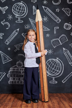 girl Hugging Giant Pencil