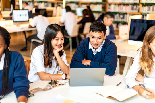 Students collaborating in modern library