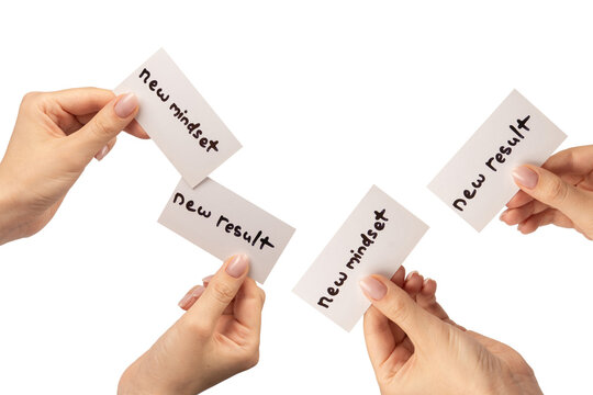 New mindset - new result  text on a card in a woman hand.