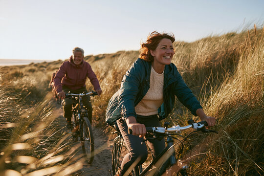 Couple bicycle dune coast joyful, together and together again