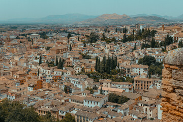 Naklejka premium Albaicín Neighborhood Granada Spain, Aerial View from Alhambra Walls over Historic White Houses and Sierra Nevada Mountains