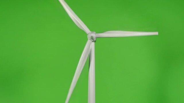 緑の背景の前に置かれたクリーンな風力発電風車のアニメーション（SDGs・環境テーマ用）