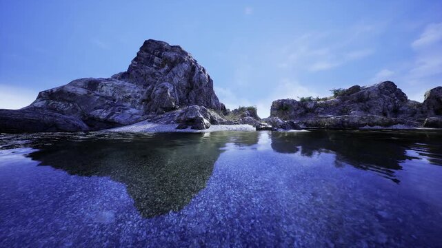 Peaceful glassy bay with gentle sunlight and lingering shadows. Quiet tide pool at dawn reflecting clear sky and stretching shadows across smooth surface