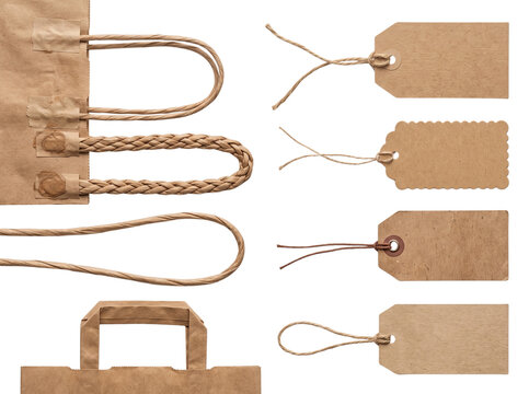 Kraft paper bags handles and blank tags on transparent background.