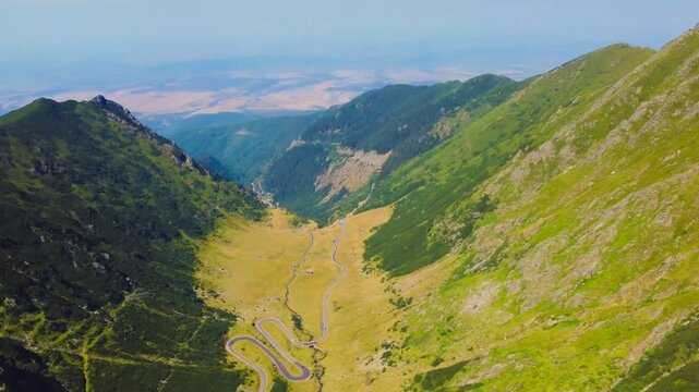 Aerial footage of Transfagarasan winding road, and Balea Lake in the Fagaras Mountains - Romania