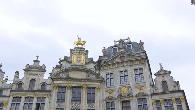 4K view of ornate historic guildhall facades with golden decorations and elaborate Baroque architecture at Grand Place in Brussels, Belgium.