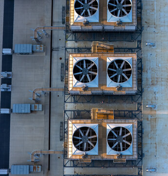 Aerial view of large industrial cooling fans installed on the flat roof of a data center in New Albany, Ohio, United States.