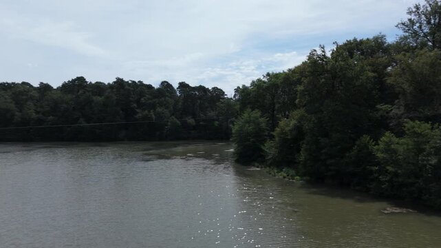 Zipline Track Over Forest Lake at Parc de Fierbois