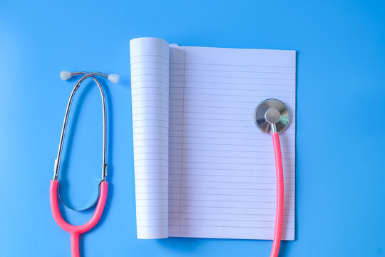 Blank white paper of note book with stethoscope.