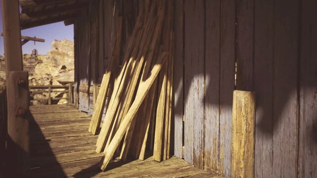 Muted tones showcase quiet farmstead with aged timber. Soft grainy imagery features peaceful settlement with weathered wooden structures in warm highlights