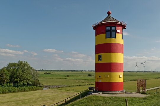 Pilsum Lighthouse (Pilsumer Leuchtturm) on a dyke, Krummhorn, Lower Saxony, Germany