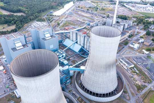 Aerial view of RWE Westfalen power plant with its prominent cooling towers, industrial infrastructure, and surrounding landscape in Hamm, Nordrhein-Westfalen, Germany.
