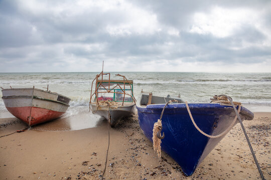 Old Fishing Boats on a Sandy Beach