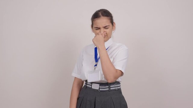 Indian Schoolgirl Covering Her Nose from Foul Smell