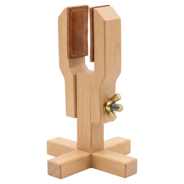 A wooden clamp with leather pads and a wingnut, isolated on a transparent background.