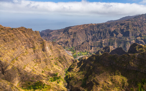 Aerial view of Topo da Montanha do Delgadinho in Santo Antao featuring rugged mountain peaks and deep valleys with rocky terrain in Corda, Ribeira Grande, Cabo Verde.