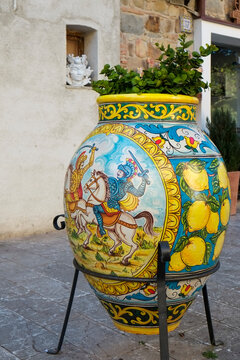 Hand-painted ceramic vase with knight and lemon motif