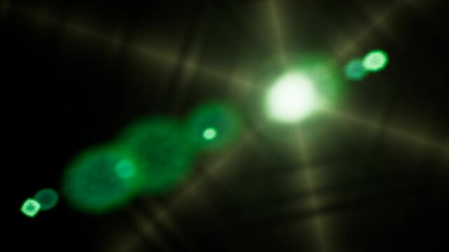 Bright green lens flare effect glowing and moving across dark digital background.