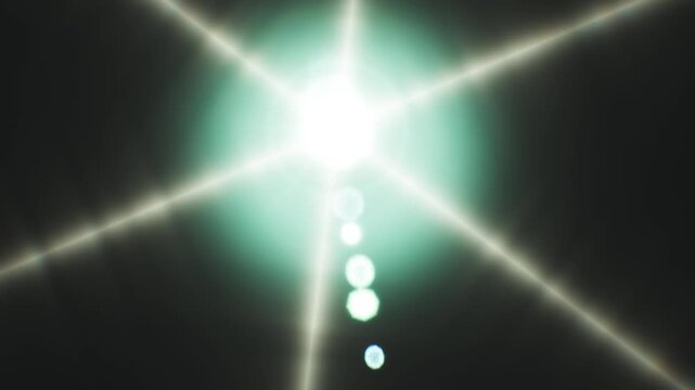 A bright and realistic lens flare effect shining intensely against a dark background