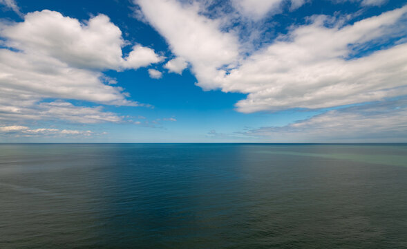 Expansive view across the North Sea from the high chalk cliffs of Flamborough Head on the Yorkshire coast, England, beneath a dramatic summer sky.