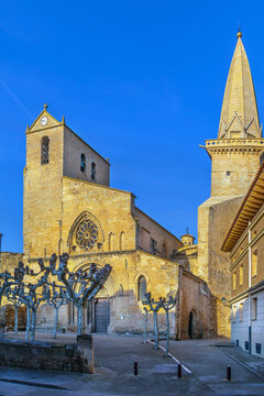 San Pedro Church in Olite, Spain, facade and tower view. Medieval romanesque portal with famous gothic needle spire