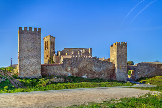 El Cerco de Artajona medieval walls in Spain, panoramic view. Historic fortress towers with gothic church behind