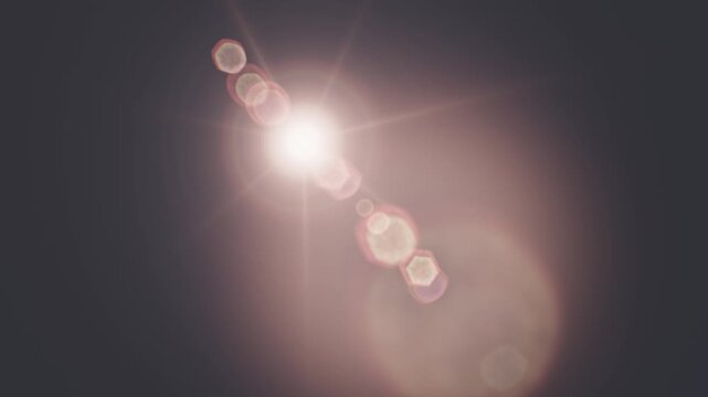Realistic digital lens flare effect with bright light streaks in 4k.