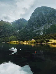 Norway scenery - lake Eikesdalsvatnet and boat with mountains reflection in the water landscape tranquil scenic nature view of More og Romsdal, summer season travel destinations in Scandinavia © EVERST