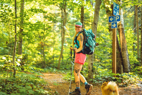 woman trekking in the forest. Traveling activity