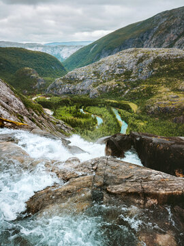 Norway landscape in Rago national park - waterfall edge aerial view river meanders through the mountain valley, travel wild nature destination moody scenery summer season in Scandinavia