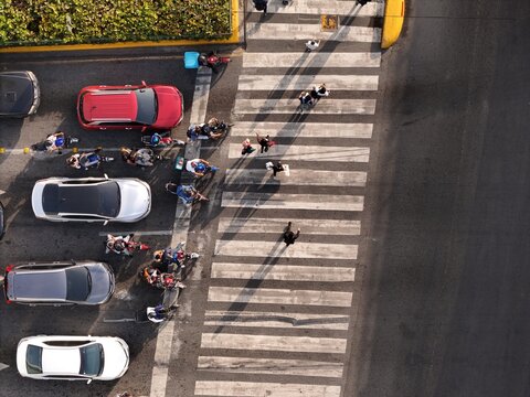 Aerial view of pedestrians crossing a busy street at Avenida John F. Kennedy in Santo Domingo, Distrito Nacional, Dominican Republic.