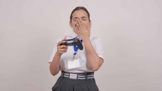 Bored Indian Schoolgirl Yawning While Gaming with Controller