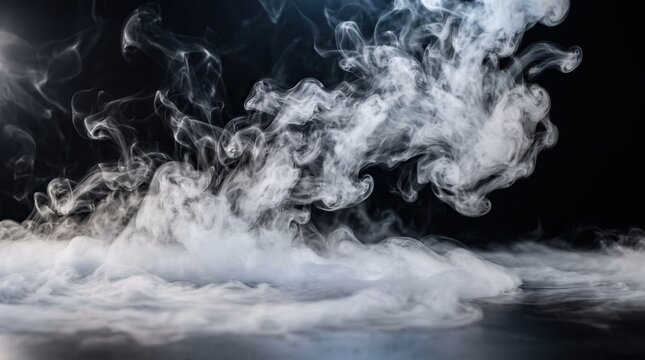 White smoke swirling and billowing across a dark black background creating ethereal wisps and flowing gaseous patterns in a studio setting