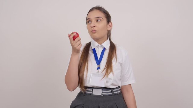 Indian Schoolgirl Eating Apple